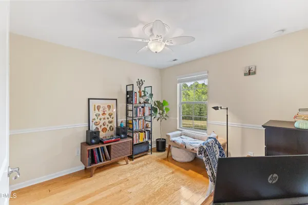 a bedroom with furniture and a window
