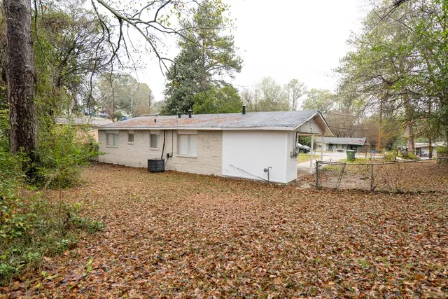 a backyard of a house with lots of green space