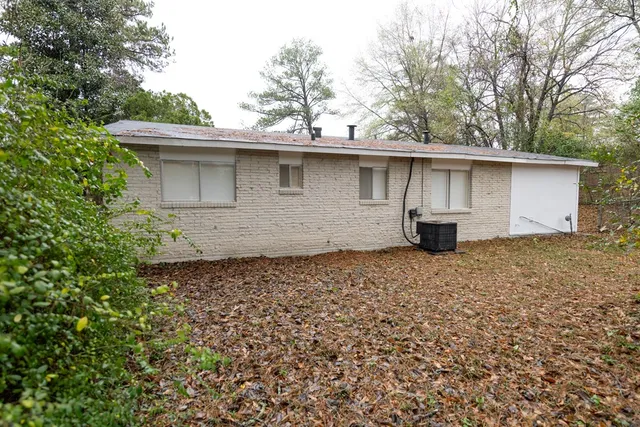 a backyard of a house with garage