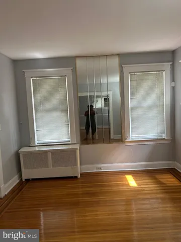 a view of room with window and hardwood floor
