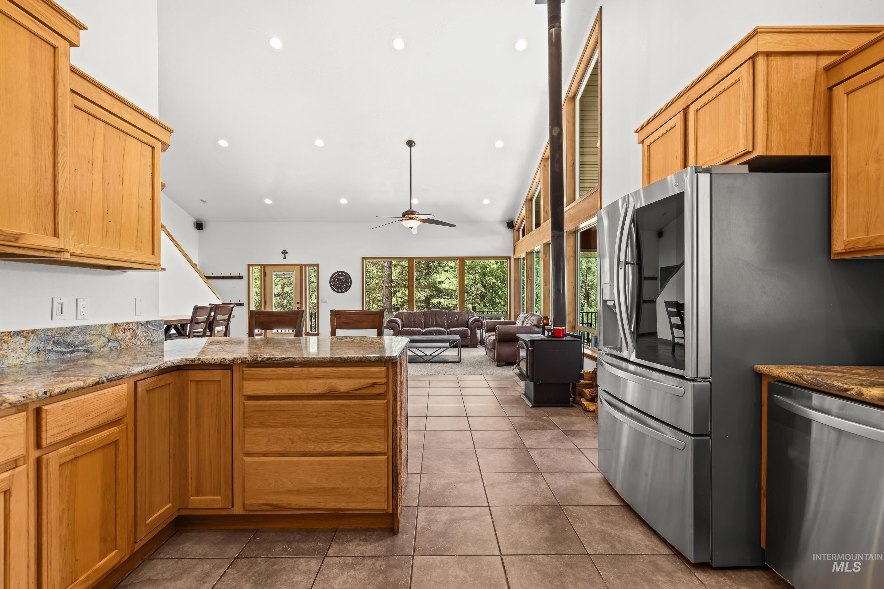 92 Cruickshank Road Horseshoe Bend, ID 83629 - Photo 20 of 50 Kitchen featuring wood cabinetry, stone countertops, and stainless steel appliances