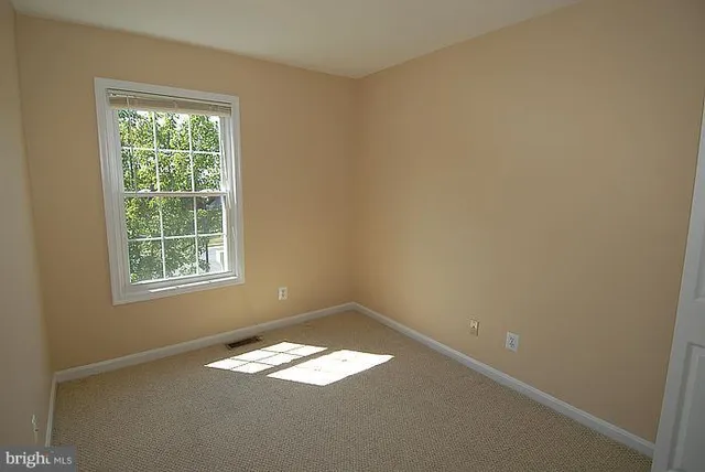 a view of empty room with a window