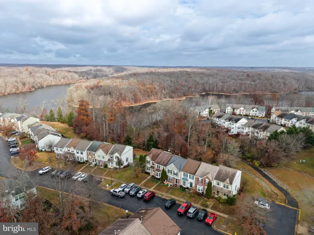 an aerial view of multiple house with yard