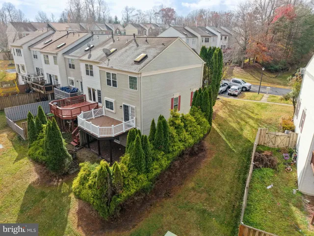 a view of a patio with table and chairs and potted plants