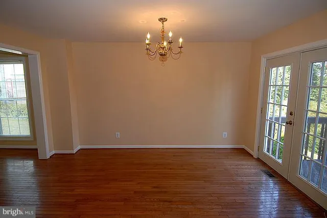 a view of a livingroom with wooden floor