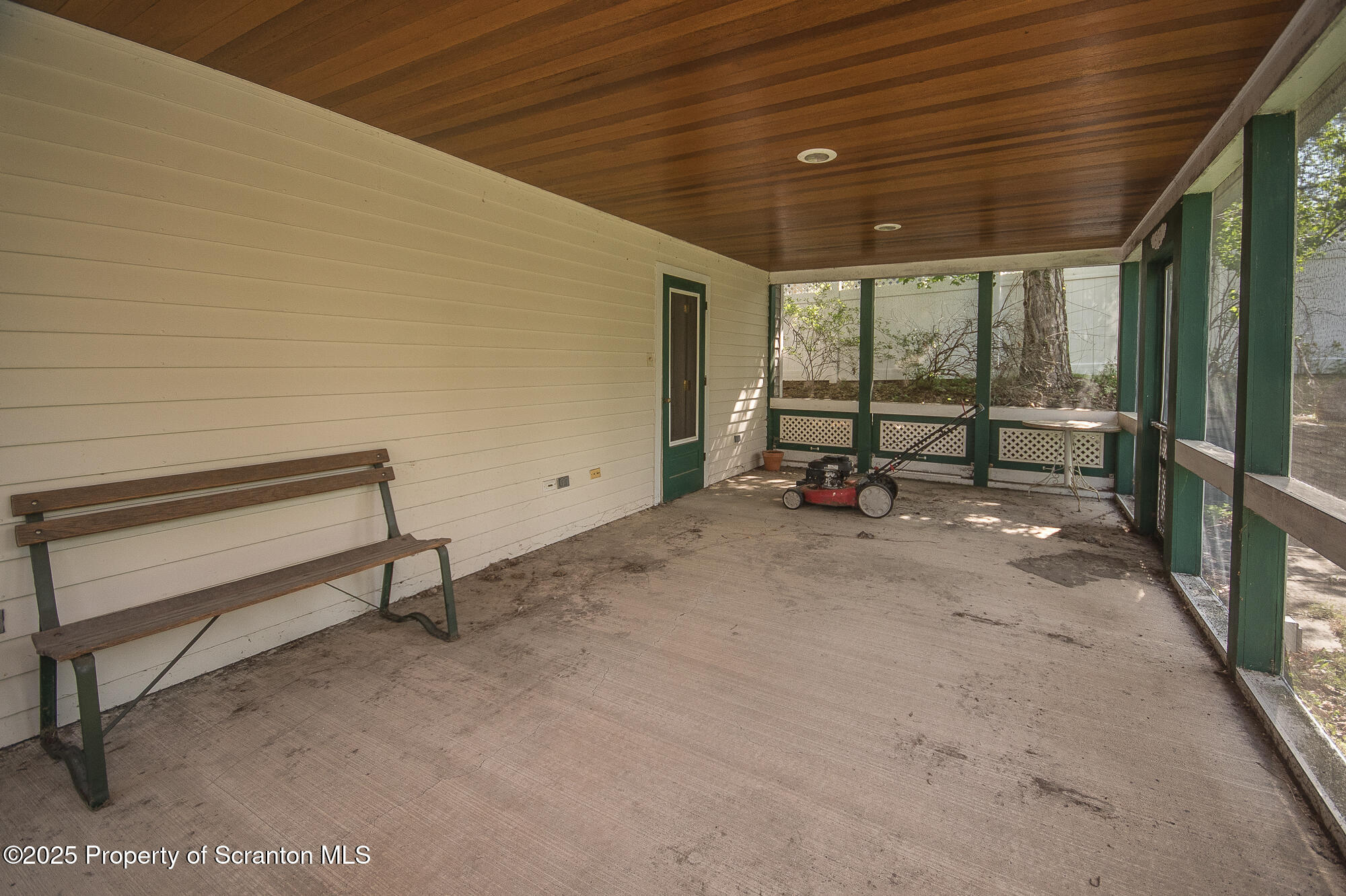 612 Clinton Street Waverly, PA 18471 - Photo 14 of 44 a view of a patio with a table and chairs