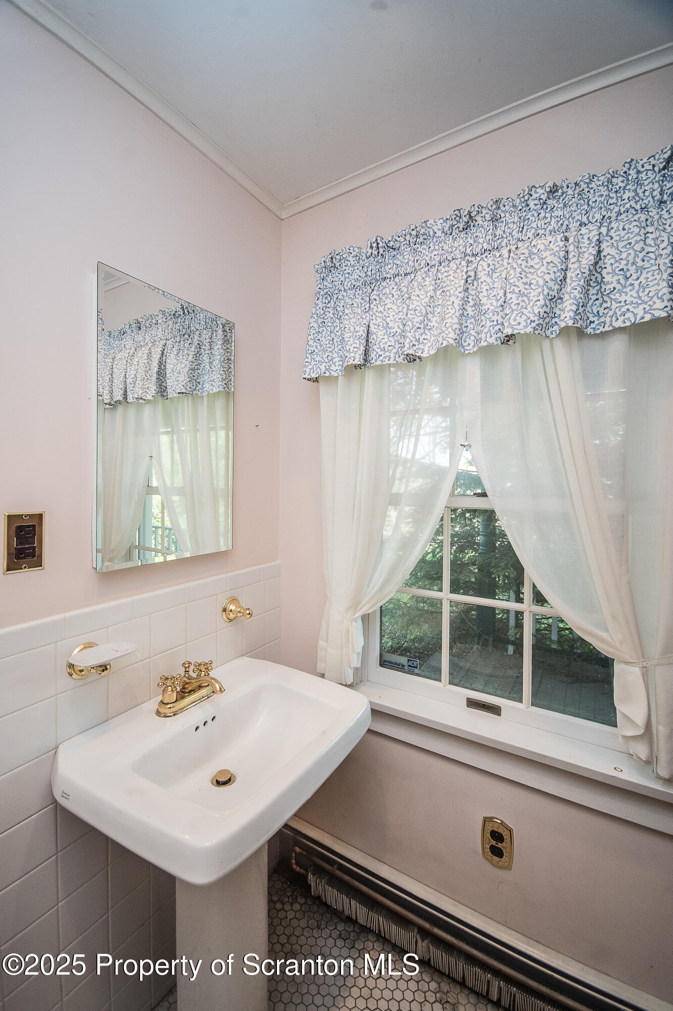 612 Clinton Street Waverly, PA 18471 - Photo 16 of 44 a bathroom with a sink and a mirror