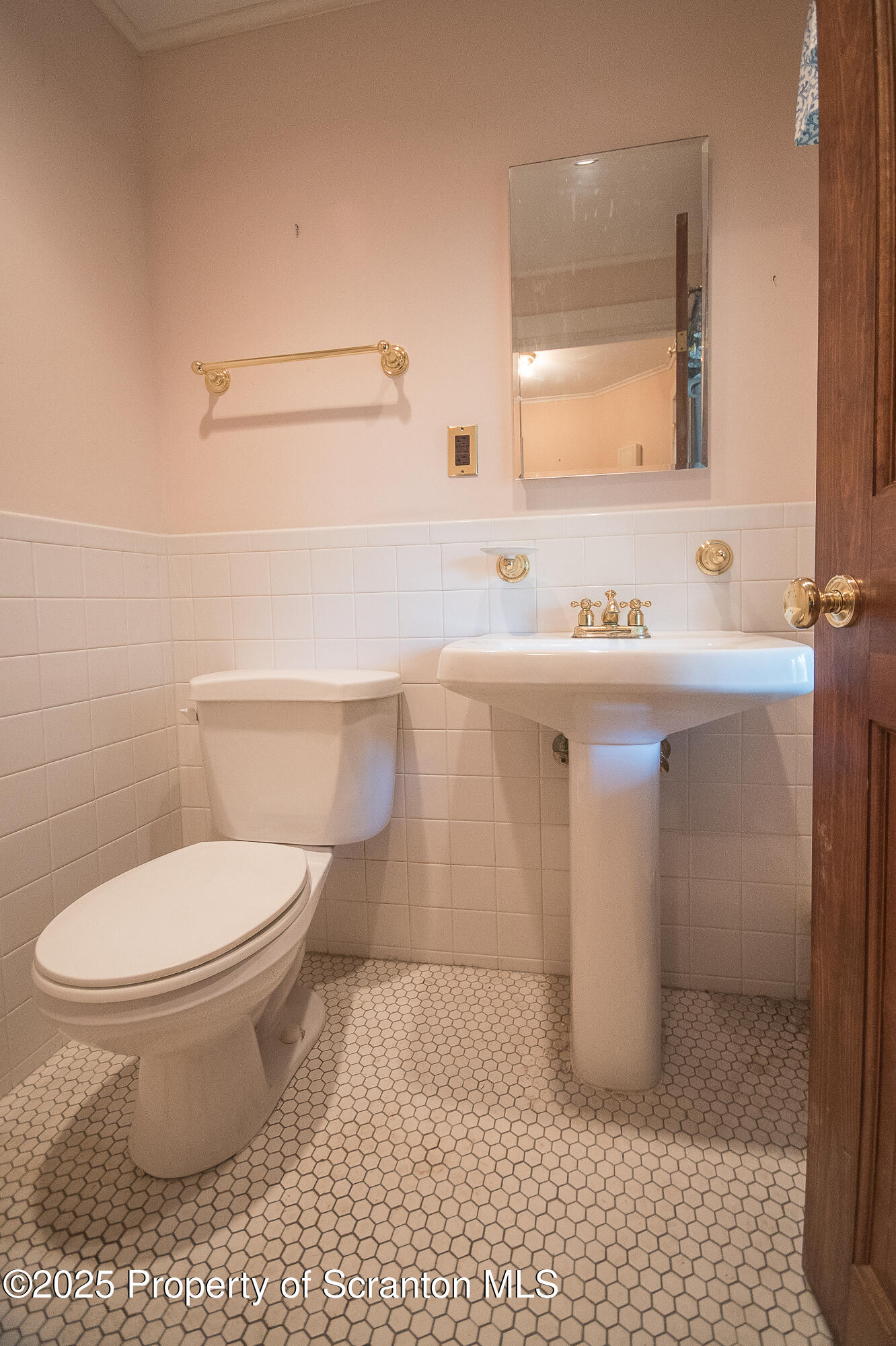 612 Clinton Street Waverly, PA 18471 - Photo 17 of 44 a bathroom with a sink a toilet and a mirror
