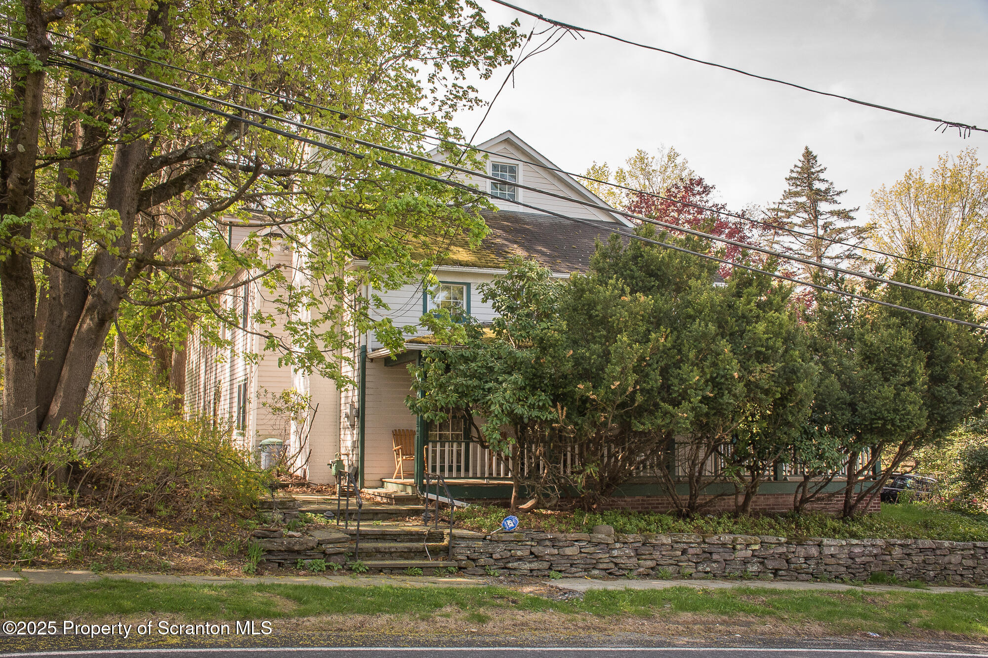 612 Clinton Street Waverly, PA 18471 - Photo 2 of 44 a front view of a house with a yard