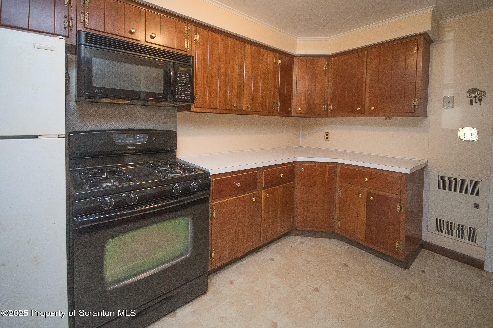 612 Clinton Street Waverly, PA 18471 - Photo 21 of 44 a kitchen with a stove and a microwave