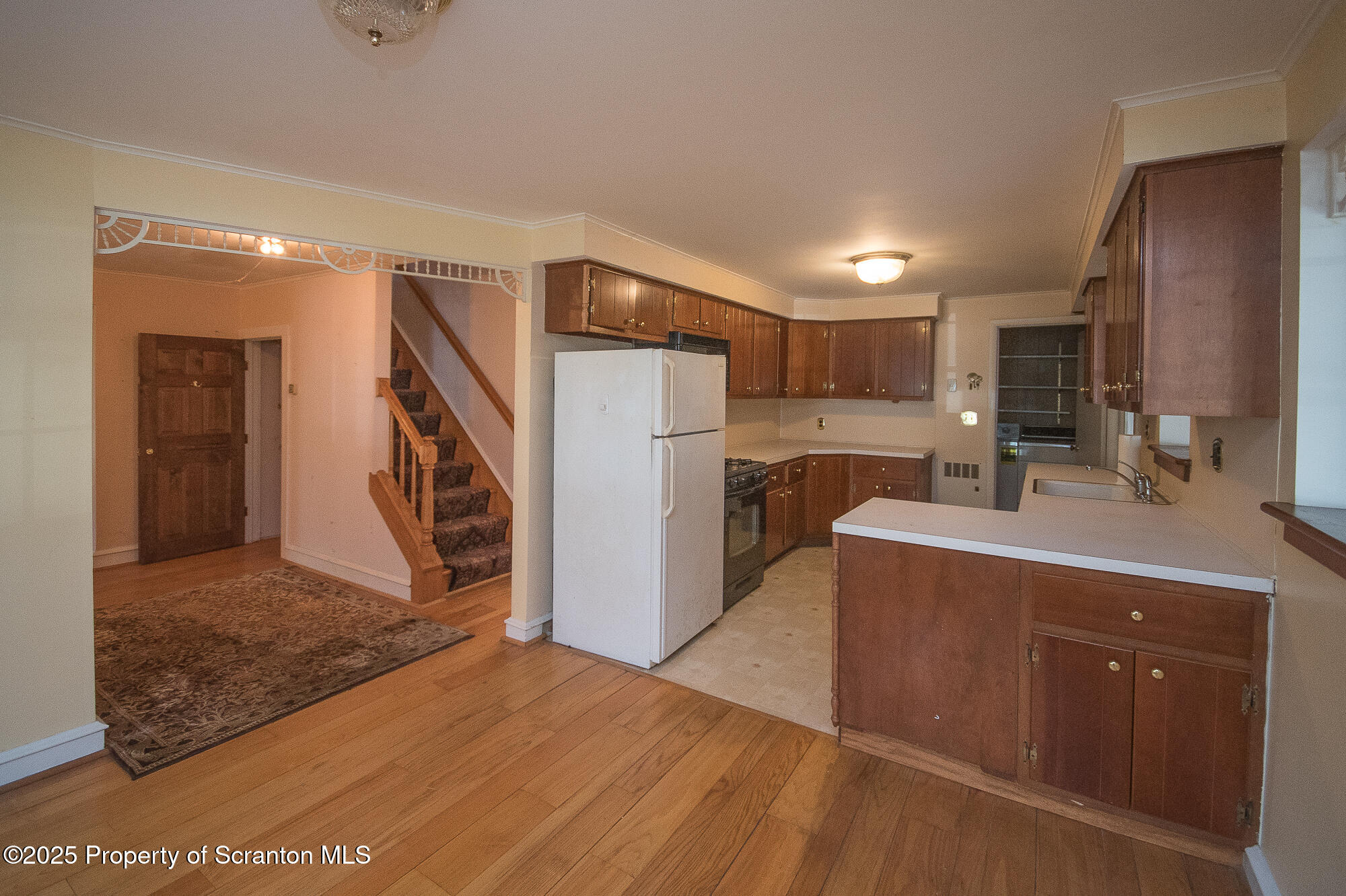 612 Clinton Street Waverly, PA 18471 - Photo 26 of 44 a kitchen with stainless steel appliances a sink cabinets and wooden floor