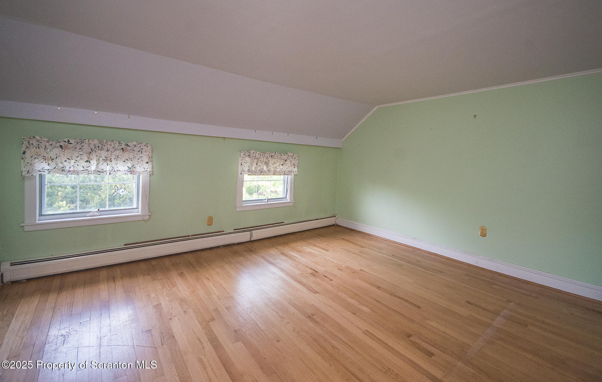 612 Clinton Street Waverly, PA 18471 - Photo 30 of 44 a view of an empty room with wooden floor and a window