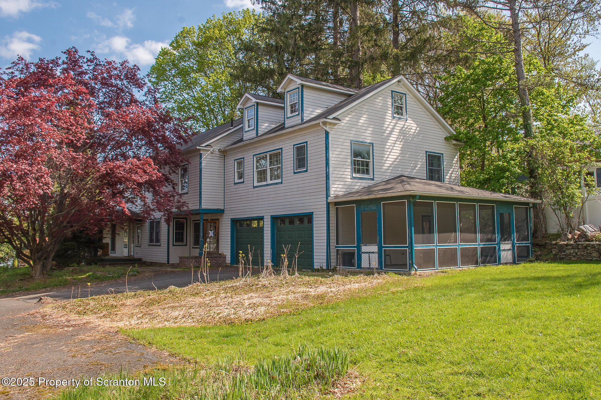 612 Clinton Street Waverly, PA 18471 - Photo 3 of 44 a front view of a house with a yard