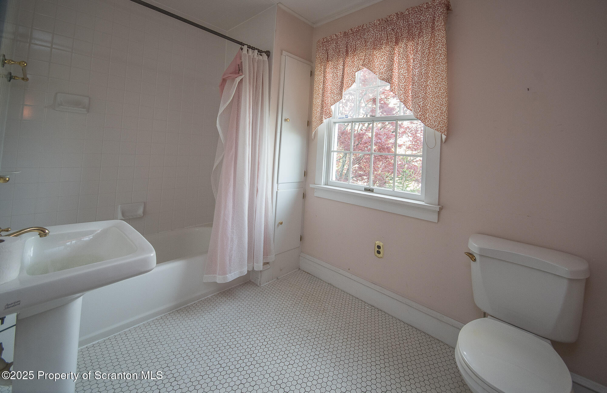 612 Clinton Street Waverly, PA 18471 - Photo 32 of 44 a bathroom with a toilet sink and tub
