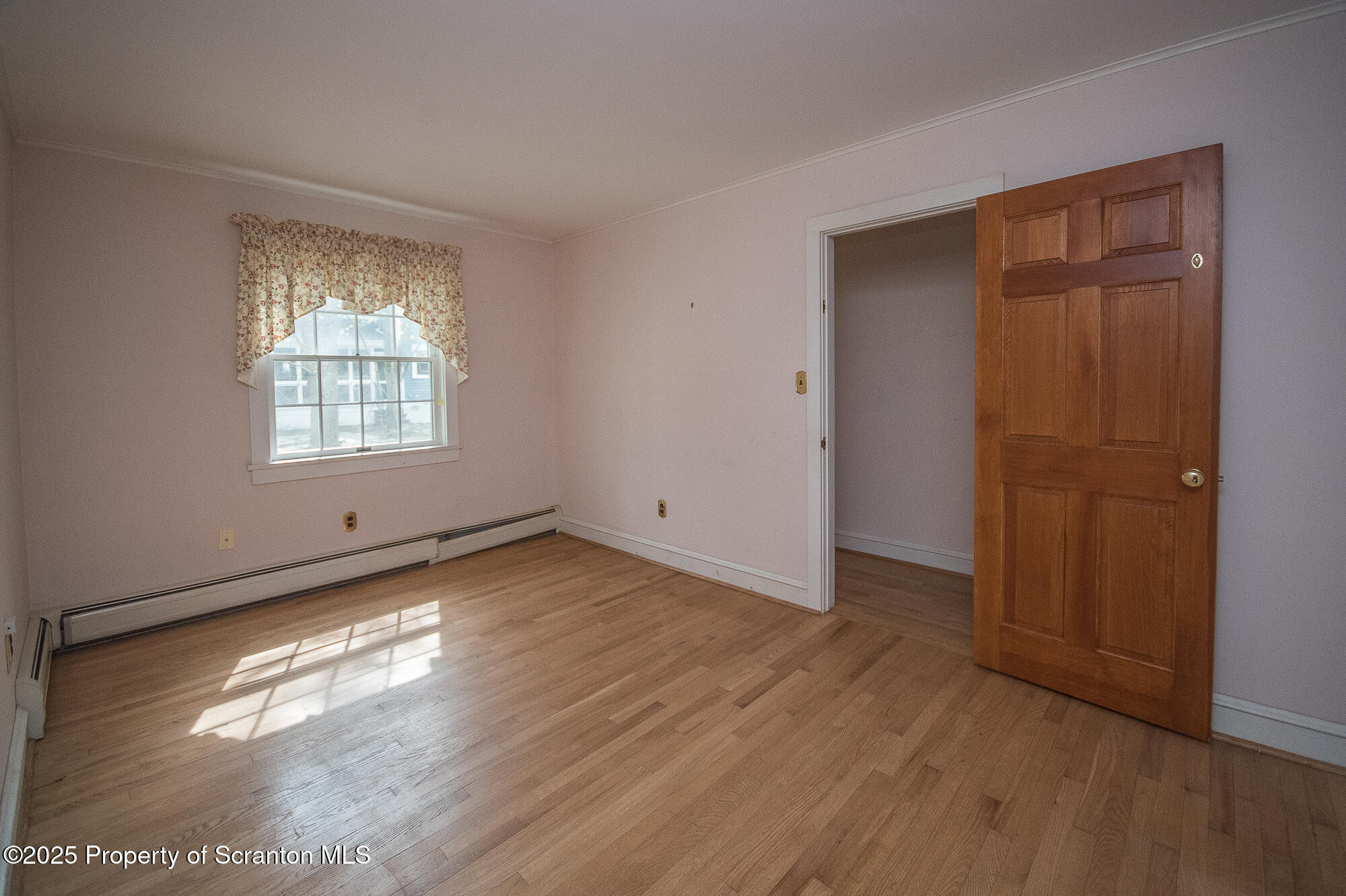 612 Clinton Street Waverly, PA 18471 - Photo 34 of 44 a view of empty room with wooden floor and fan