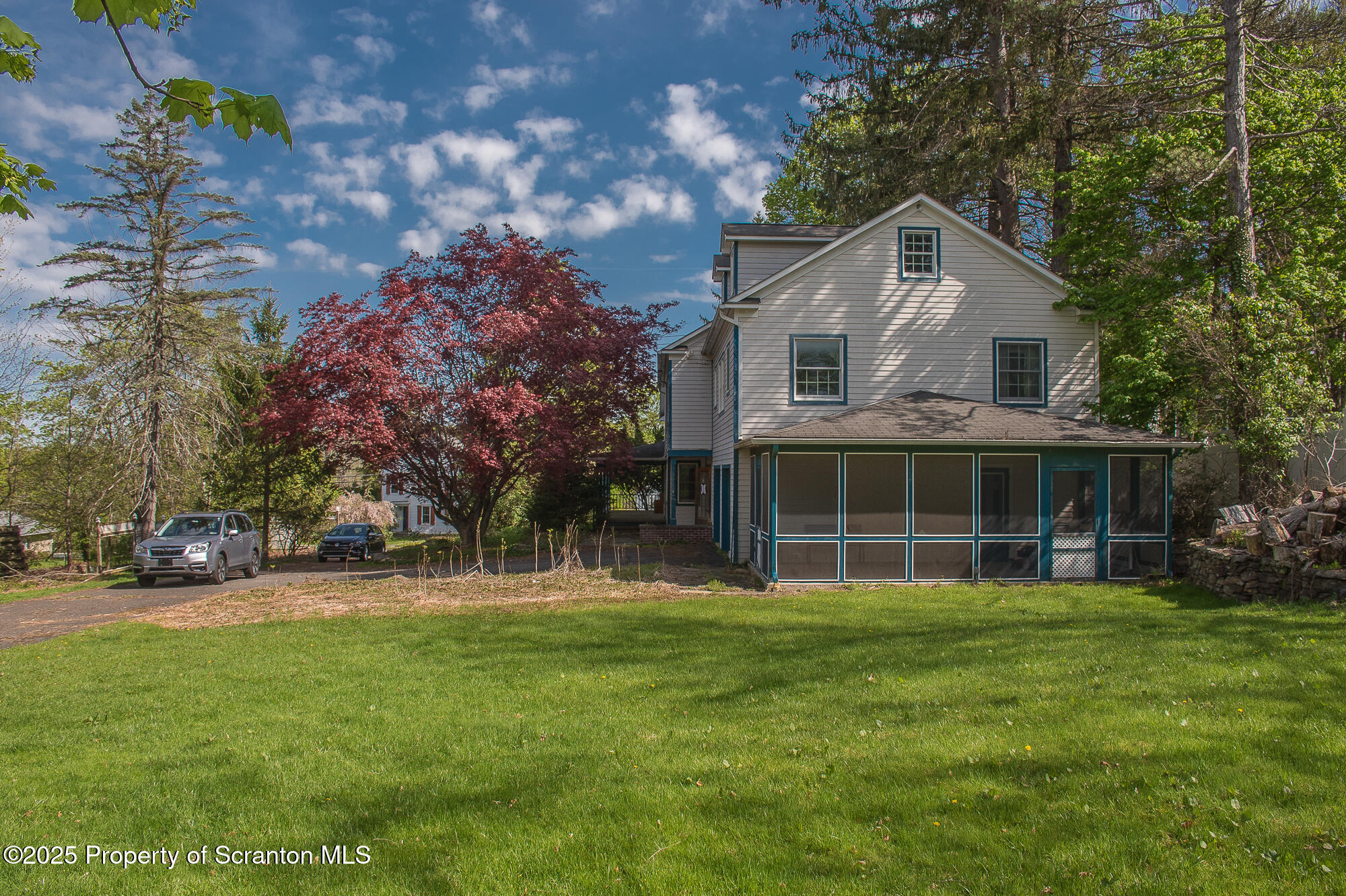 612 Clinton Street Waverly, PA 18471 - Photo 4 of 44 a front view of a house with a yard