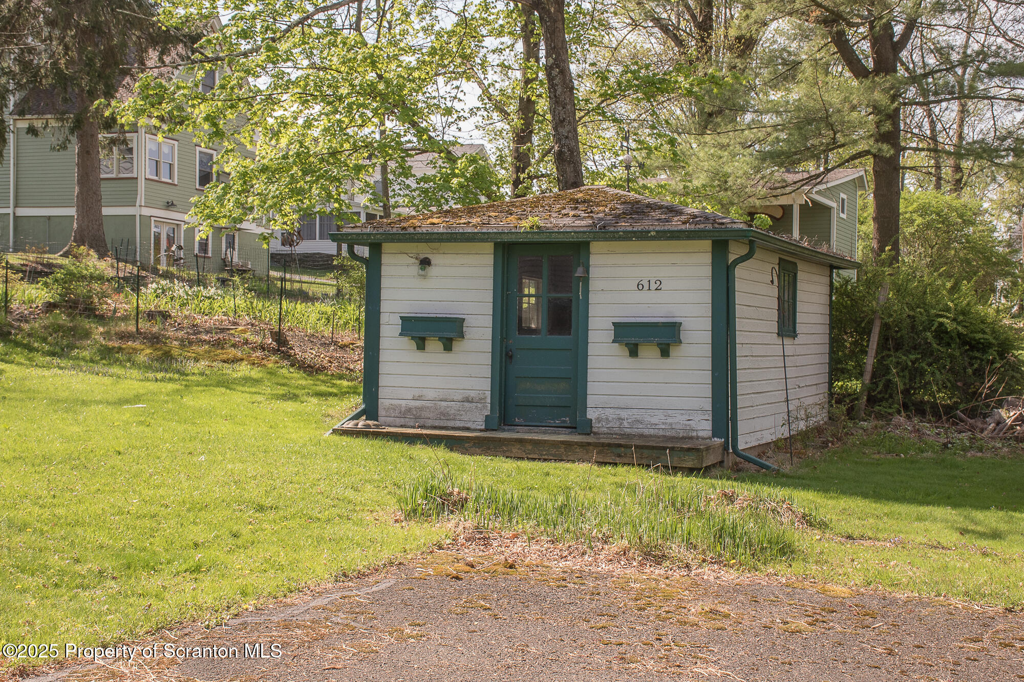 612 Clinton Street Waverly, PA 18471 - Photo 5 of 44 a view of a house with backyard and tree