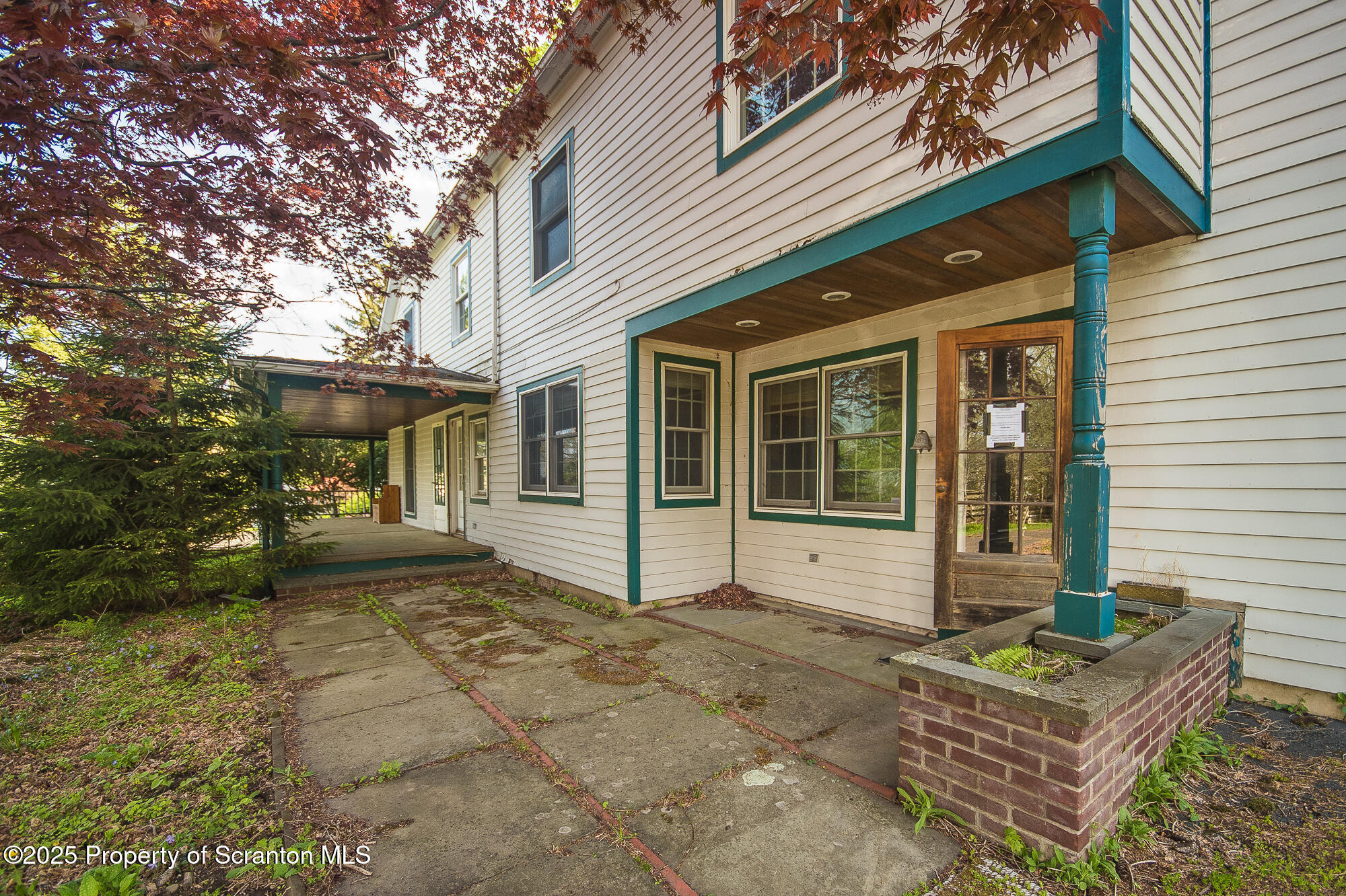 612 Clinton Street Waverly, PA 18471 - Photo 6 of 44 a front view of a house with garden