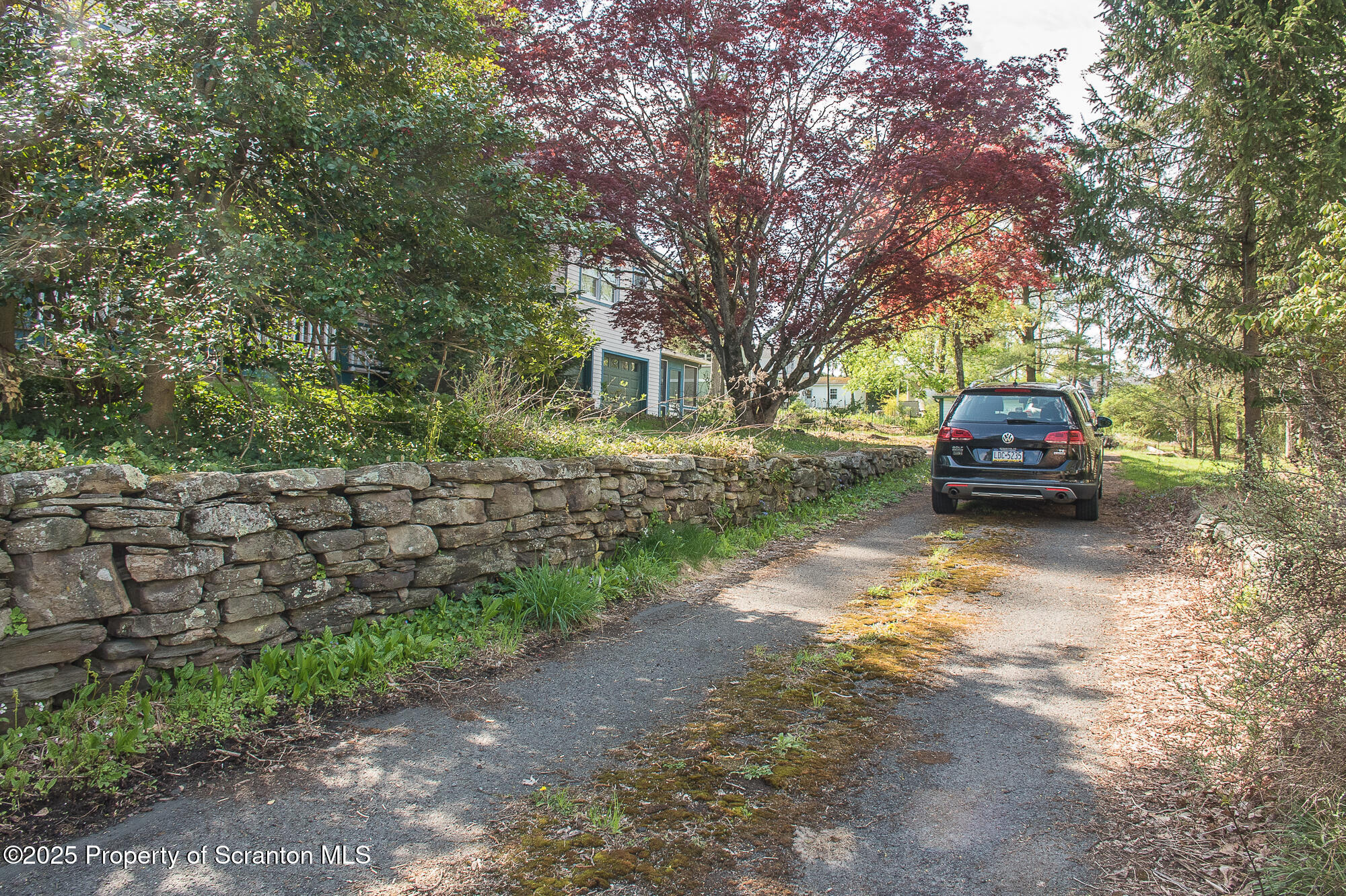 612 Clinton Street Waverly, PA 18471 - Photo 10 of 44 a car parked in front of a house