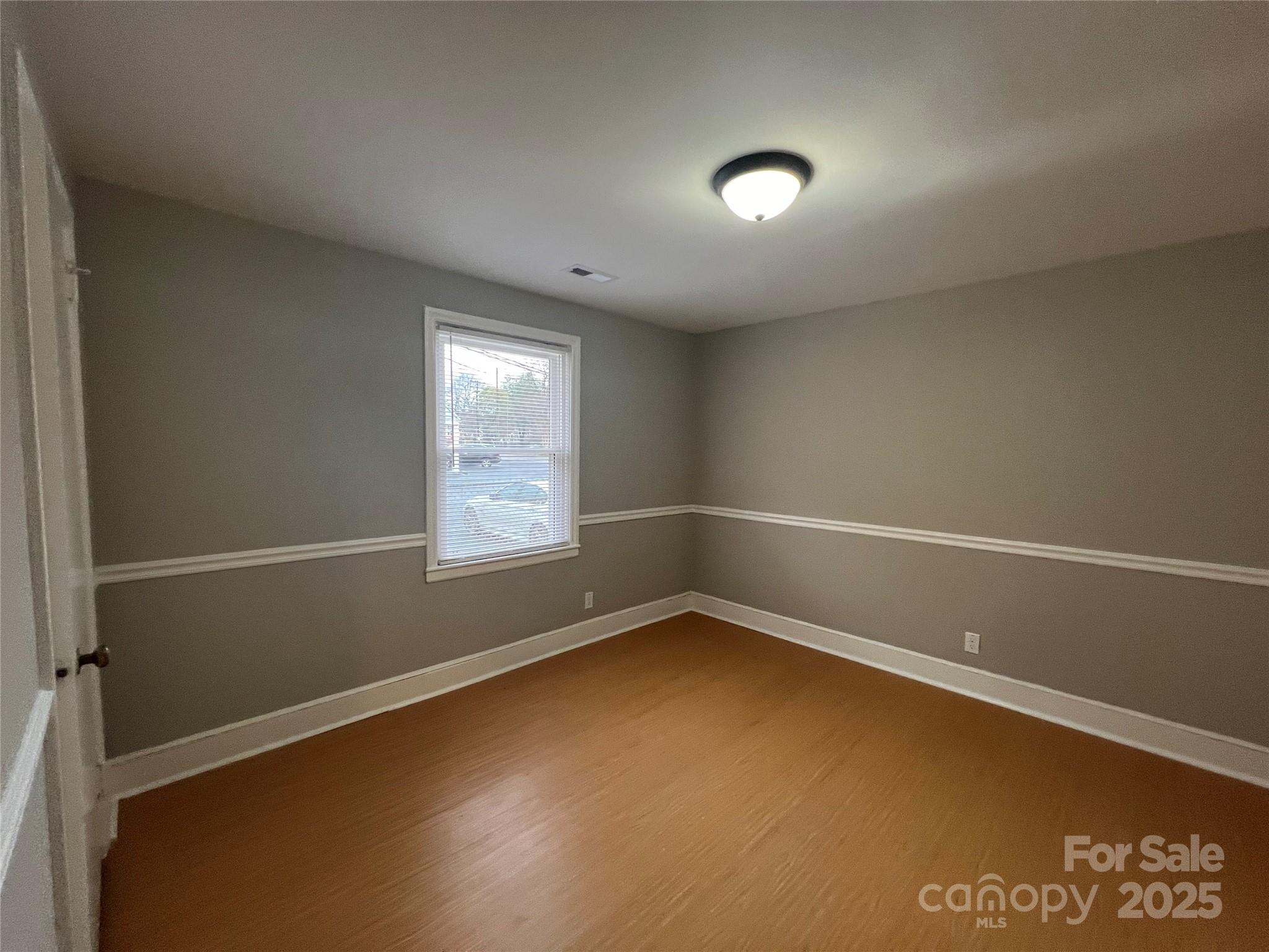 3113 Tuckaseegee Road Charlotte, NC 28208 - Photo 11 of 12 a view of an empty room with a window