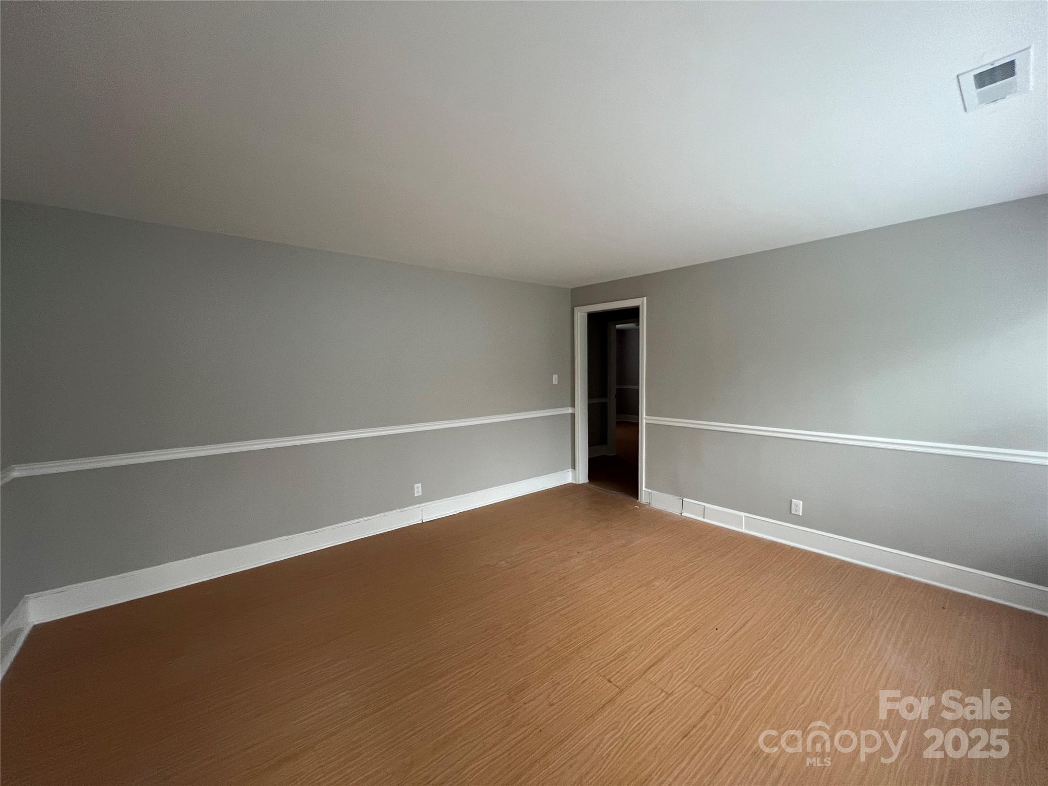 3113 Tuckaseegee Road Charlotte, NC 28208 - Photo 7 of 12 a view of an empty room with a window