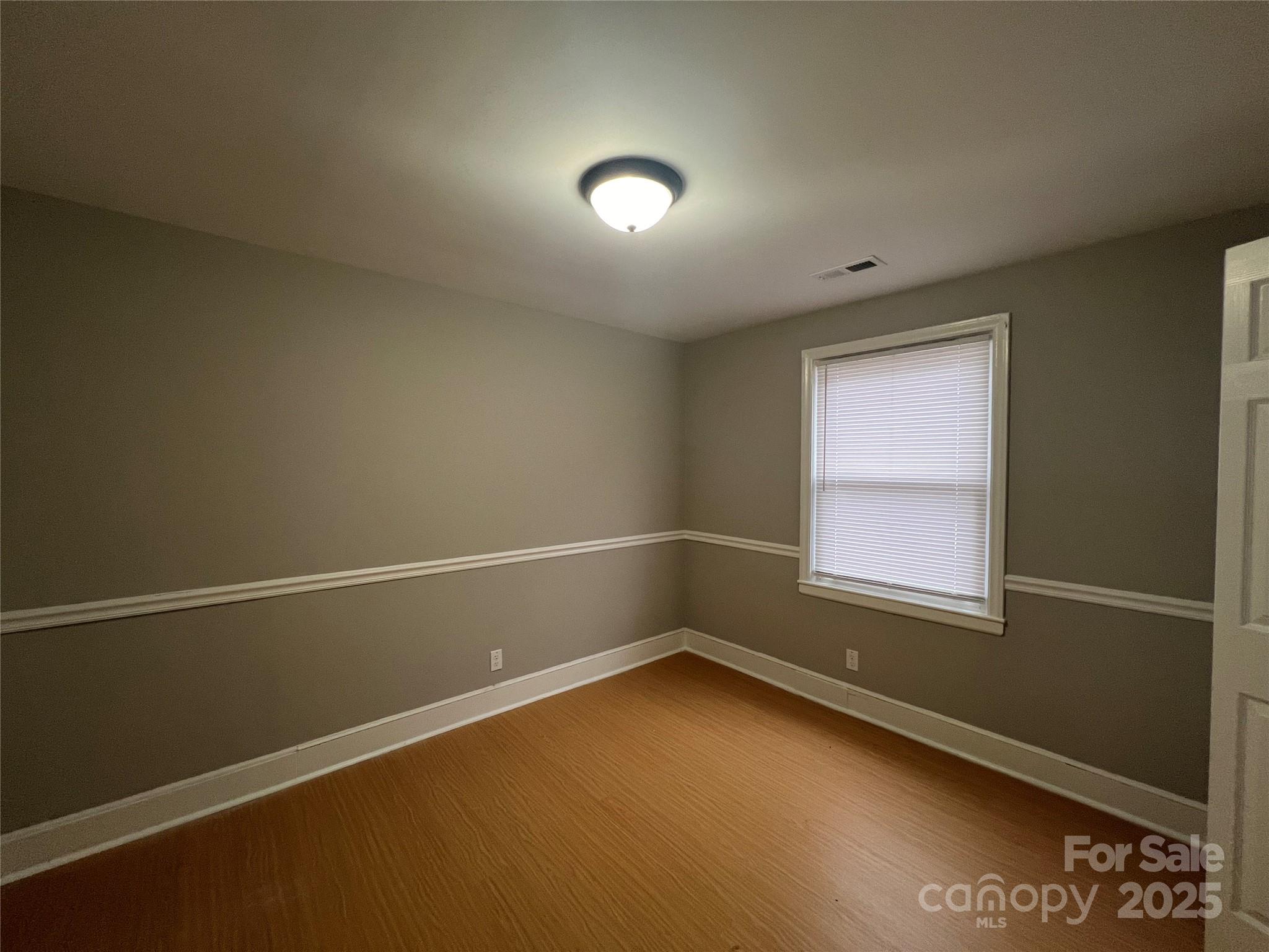 3113 Tuckaseegee Road Charlotte, NC 28208 - Photo 9 of 12 an empty room with a empty space and window
