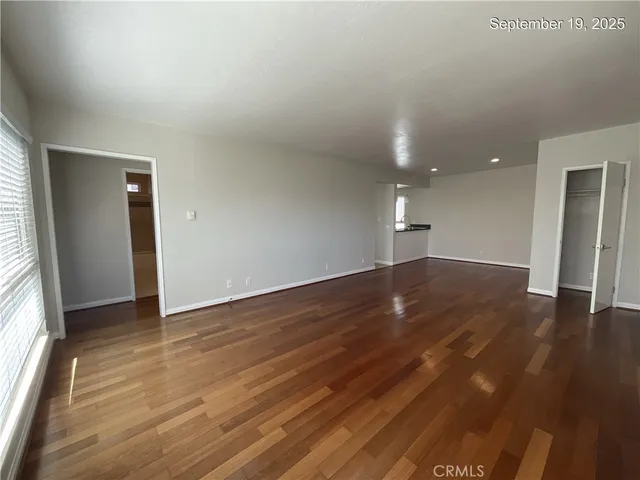 a kitchen with a refrigerator and a stove top oven