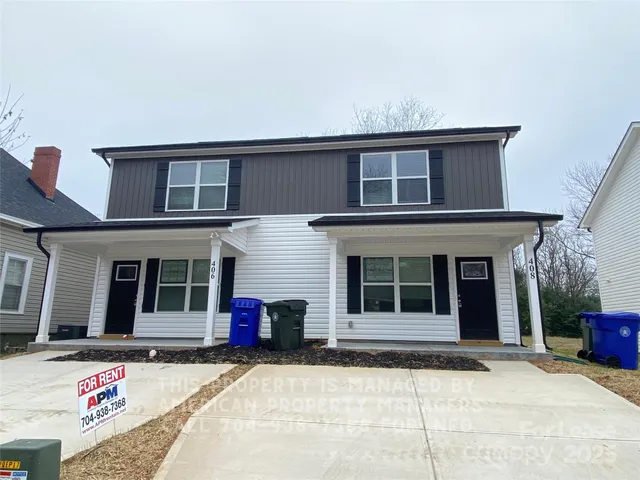 a front view of a house with a garage