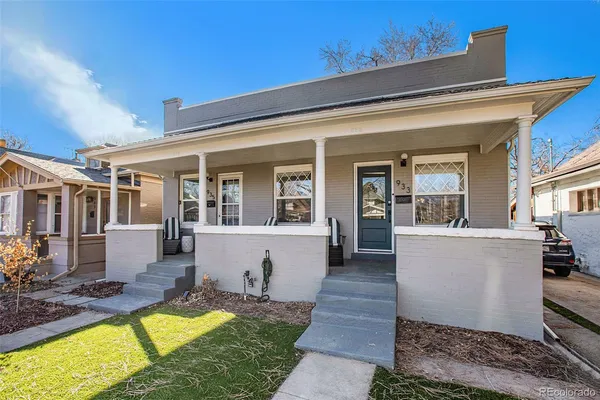 a view of a house with swimming pool and sitting area