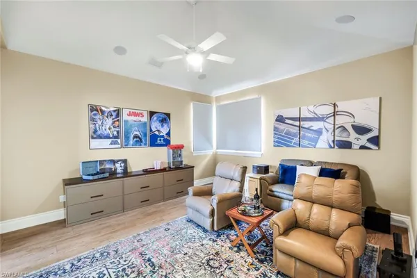 a living room with furniture and a rug