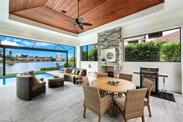 a living room with furniture fireplace and outdoor view