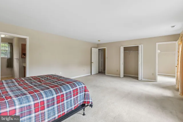 a bedroom with a bed and a cabinets