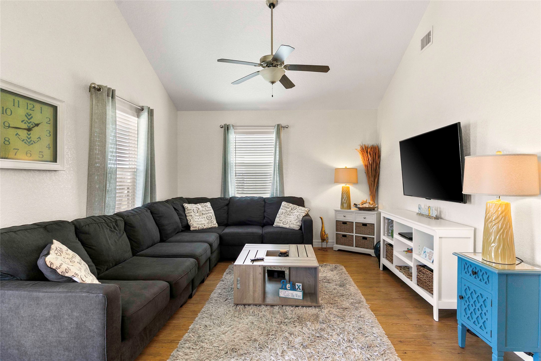 757 Bluewater Highway Surfside Beach, TX 77541 - Photo 11 of 44 a living room with furniture and a flat screen tv