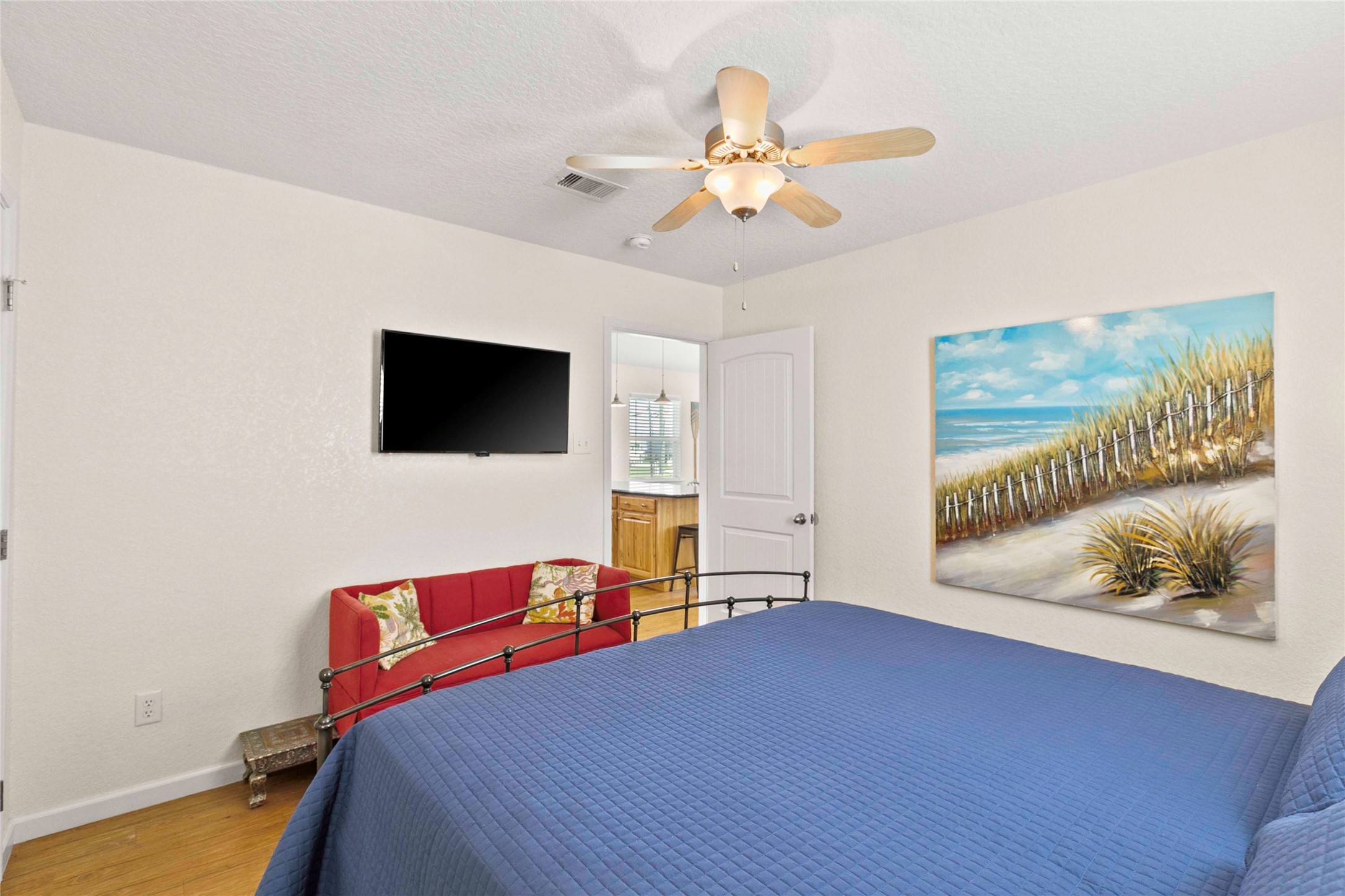 757 Bluewater Highway Surfside Beach, TX 77541 - Photo 20 of 44 a bedroom with a bed and a flat screen tv