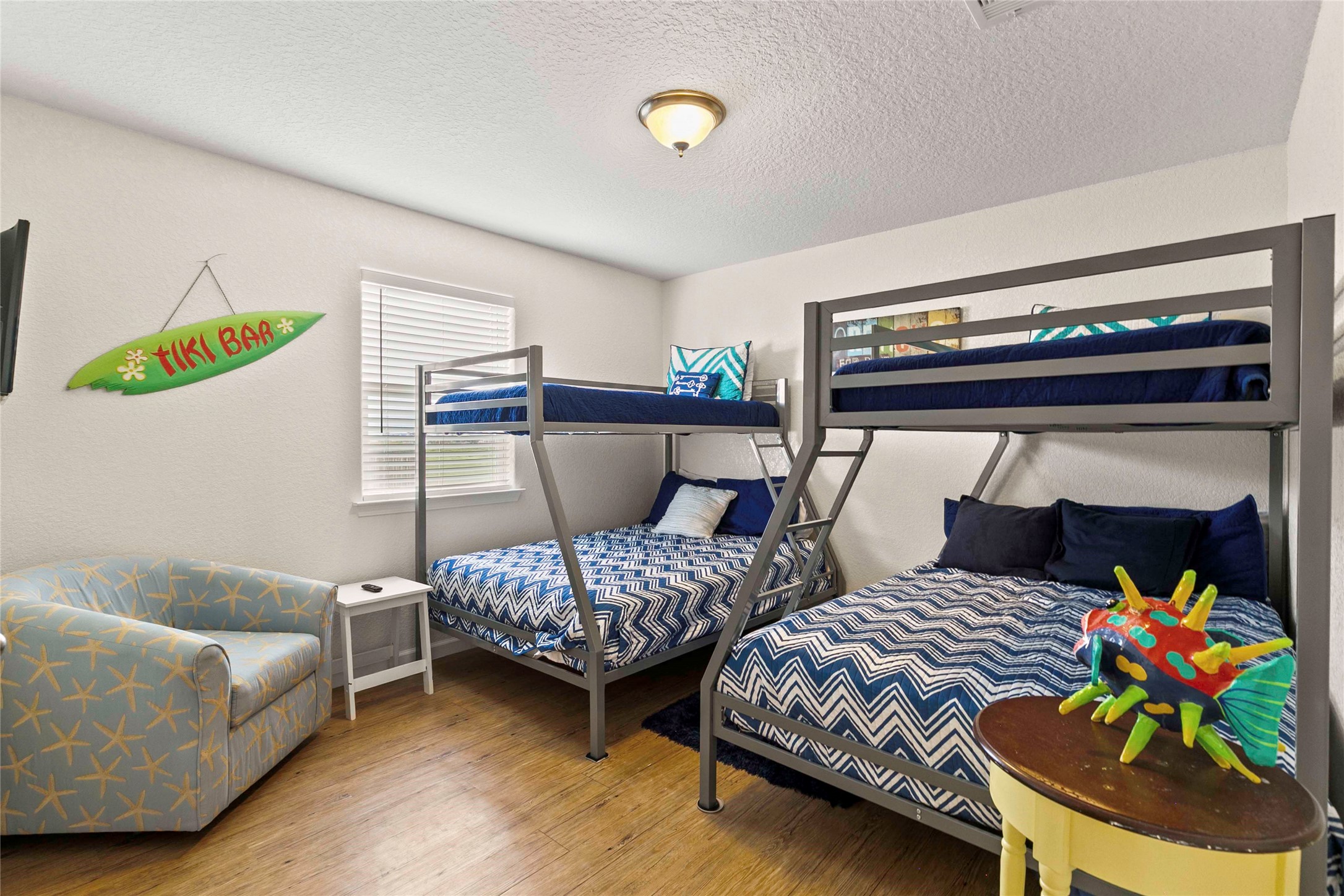 757 Bluewater Highway Surfside Beach, TX 77541 - Photo 27 of 44 a bedroom with two beds and painting on the wall