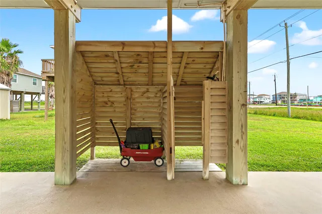a building outdoor space with patio furniture and garden