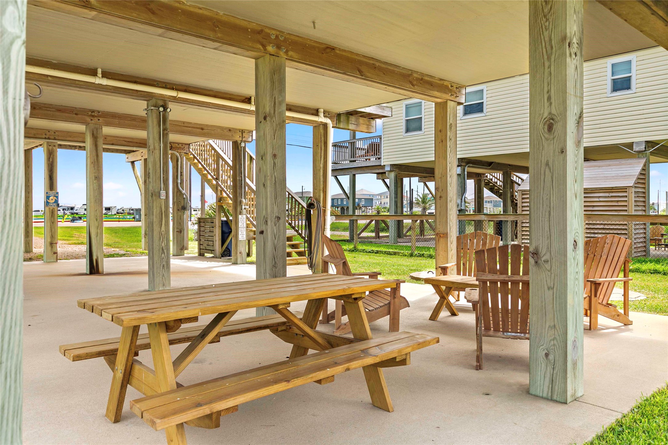757 Bluewater Highway Surfside Beach, TX 77541 - Photo 32 of 44 a building outdoor space with patio furniture and garden