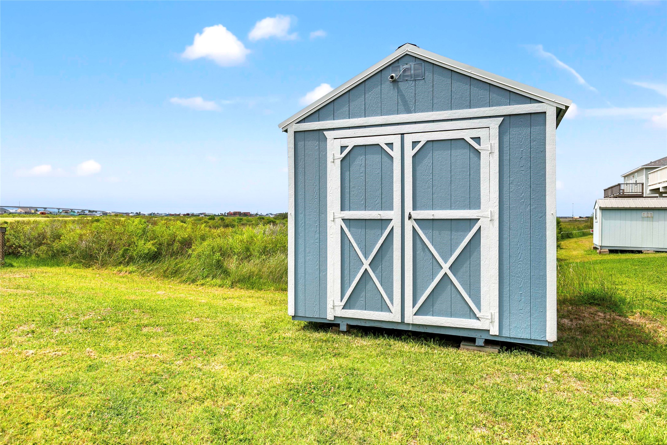 757 Bluewater Highway Surfside Beach, TX 77541 - Photo 33 of 44 a front view of a house with garden