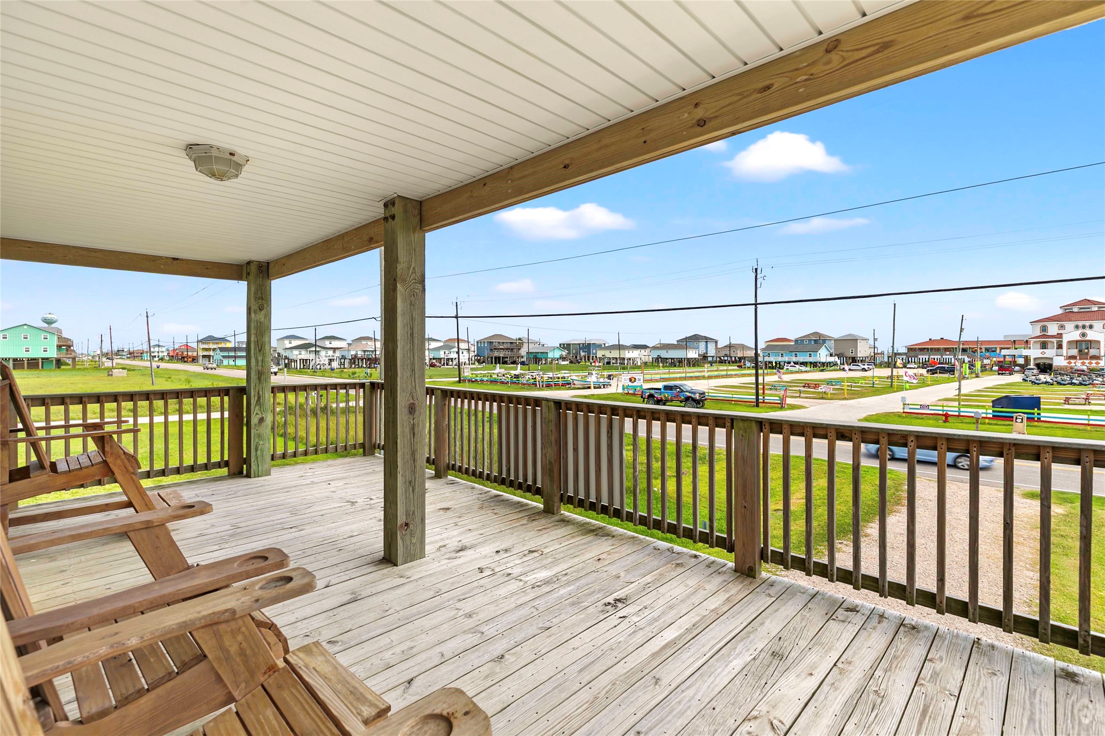 757 Bluewater Highway Surfside Beach, TX 77541 - Photo 37 of 44 a balcony with furniture and city view