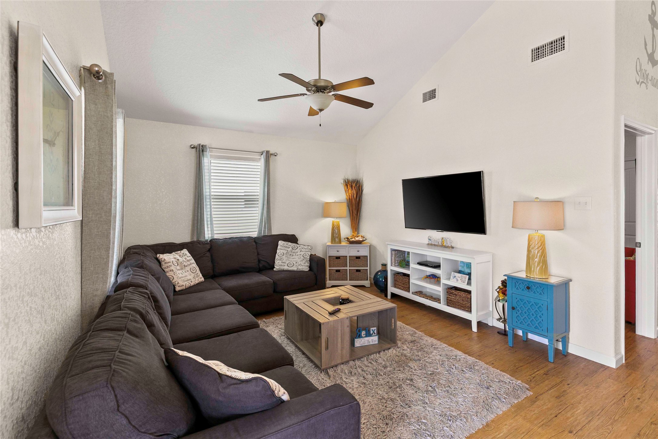 757 Bluewater Highway Surfside Beach, TX 77541 - Photo 10 of 44 a living room with furniture and a flat screen tv