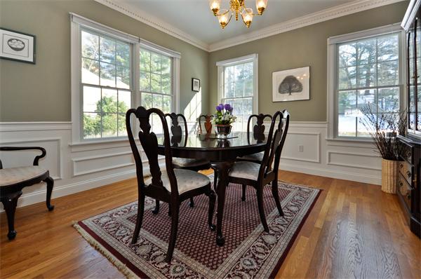 37 Ware Road Needham, MA 02492 - Photo 11 of 17 a view of a dining room with furniture a rug and wooden floor