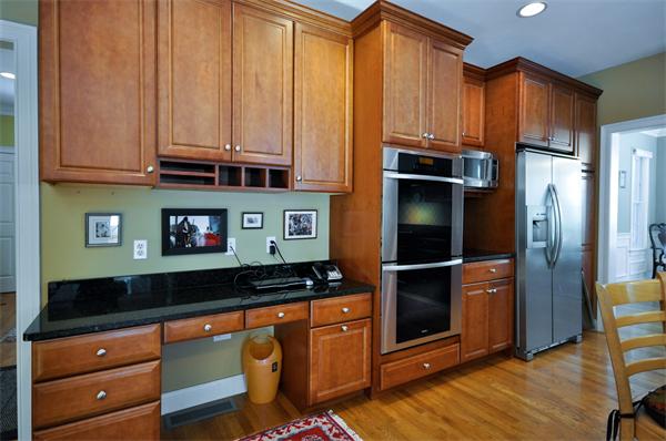 37 Ware Road Needham, MA 02492 - Photo 5 of 17 a kitchen with stainless steel appliances a refrigerator and a stove top oven