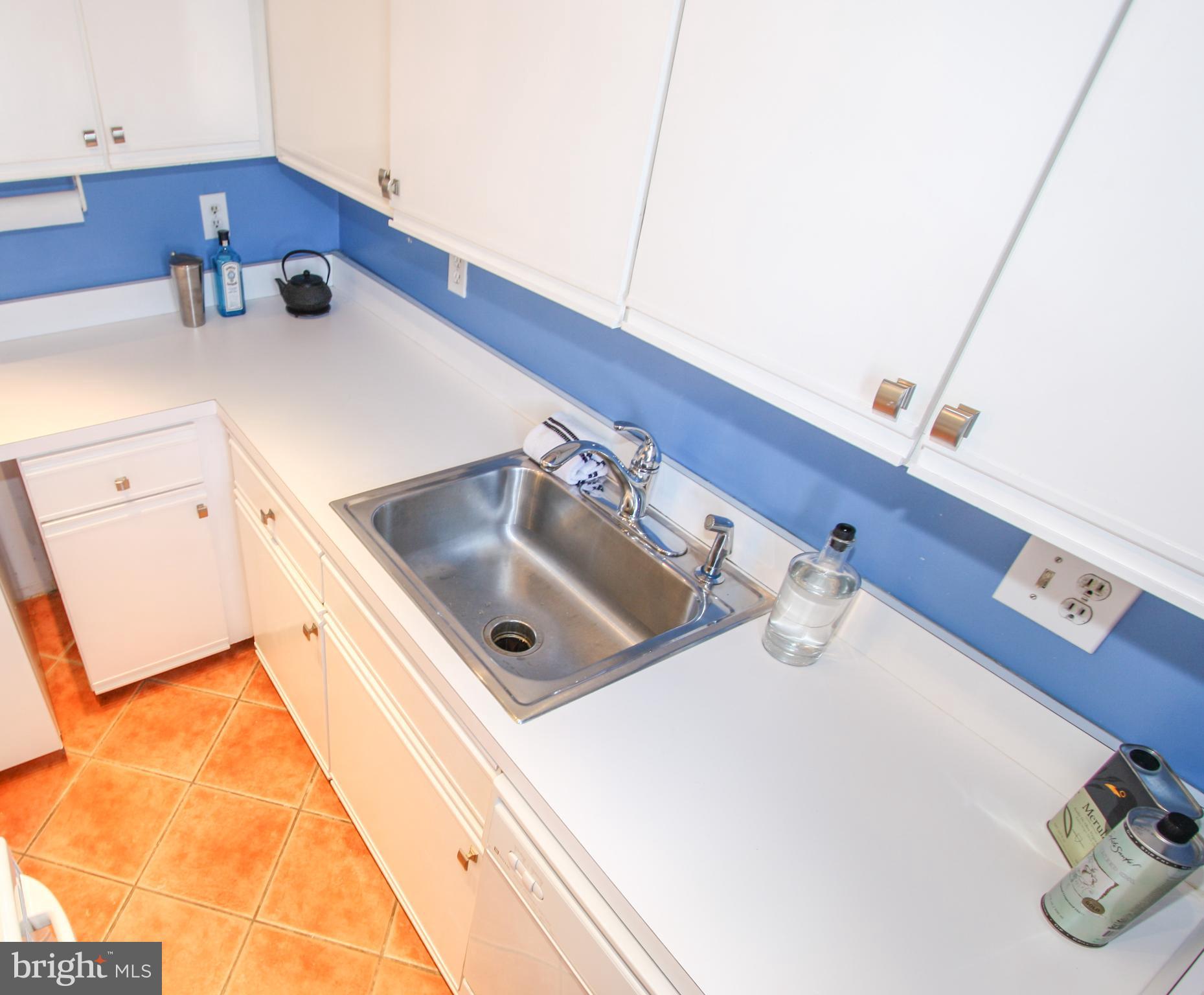 1434 Potomac Avenue Southeast, Unit 5 Washington, DC 20003 - Photo 15 of 38 a kitchen with a sink and a wooden floor