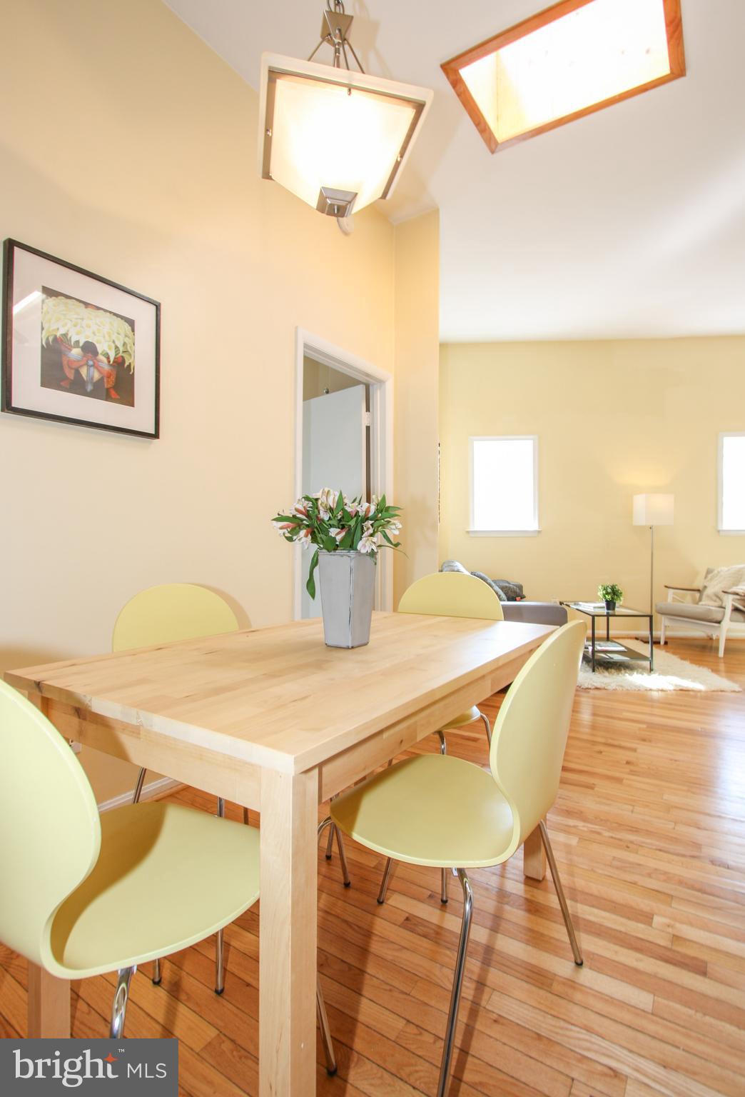 1434 Potomac Avenue Southeast, Unit 5 Washington, DC 20003 - Photo 18 of 38 a dining room with furniture and wooden floor