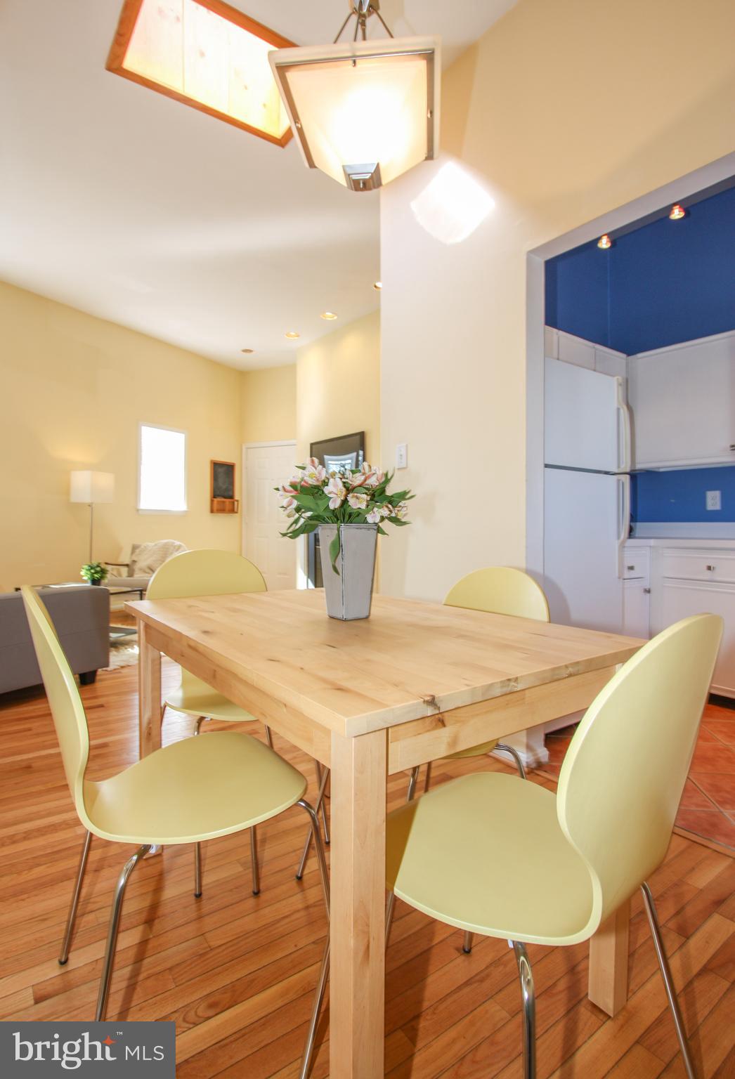 1434 Potomac Avenue Southeast, Unit 5 Washington, DC 20003 - Photo 19 of 38 a view of a dining room with furniture and wooden floor