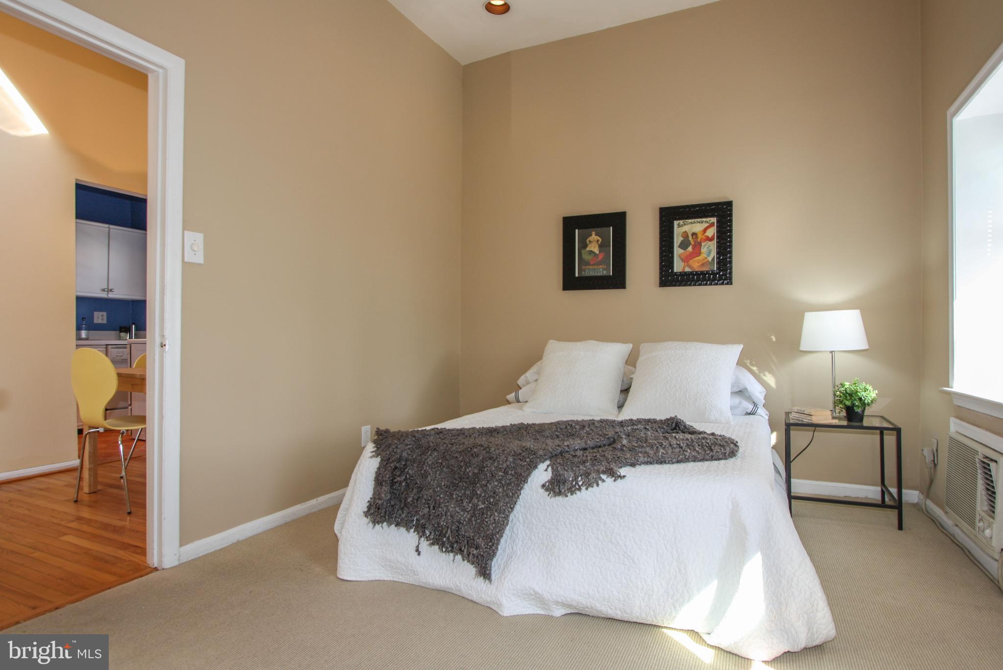 1434 Potomac Avenue Southeast, Unit 5 Washington, DC 20003 - Photo 21 of 38 a bedroom with a large bed and a lamp