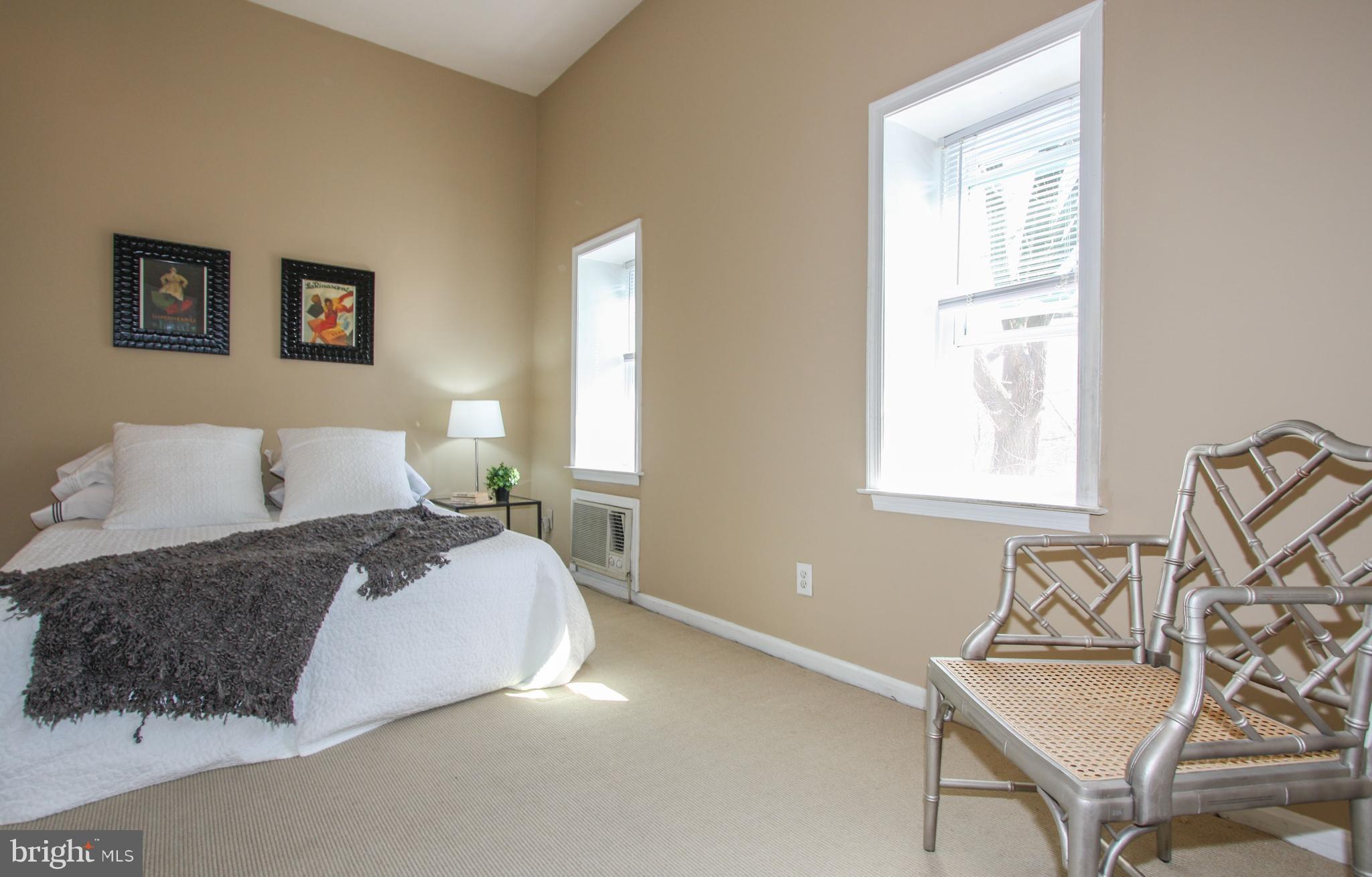 1434 Potomac Avenue Southeast, Unit 5 Washington, DC 20003 - Photo 25 of 38 a bedroom with a bed and wooden floor