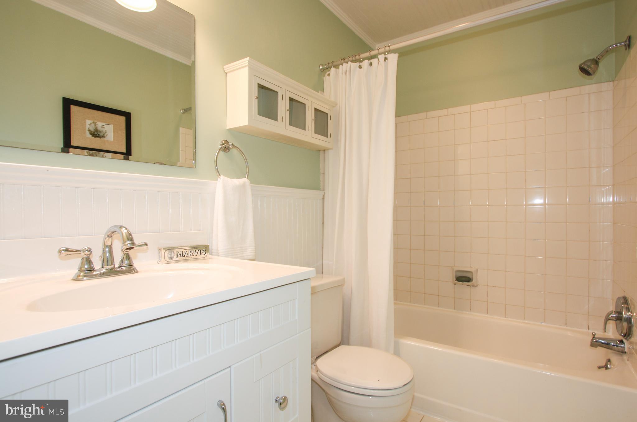 1434 Potomac Avenue Southeast, Unit 5 Washington, DC 20003 - Photo 26 of 38 a bathroom with a sink a toilet and shower