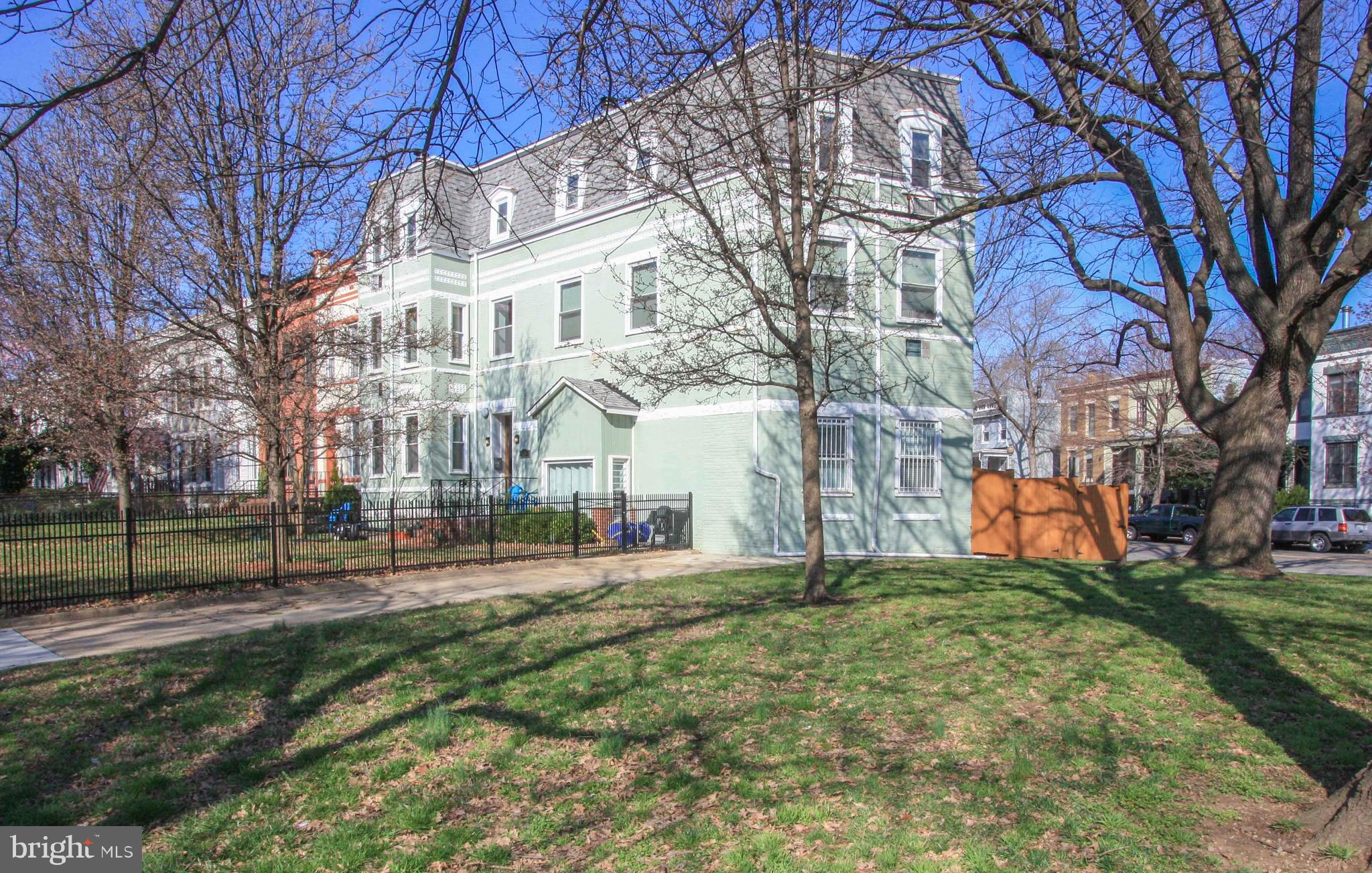 1434 Potomac Avenue Southeast, Unit 5 Washington, DC 20003 - Photo 34 of 38 a front view of a building with a yard