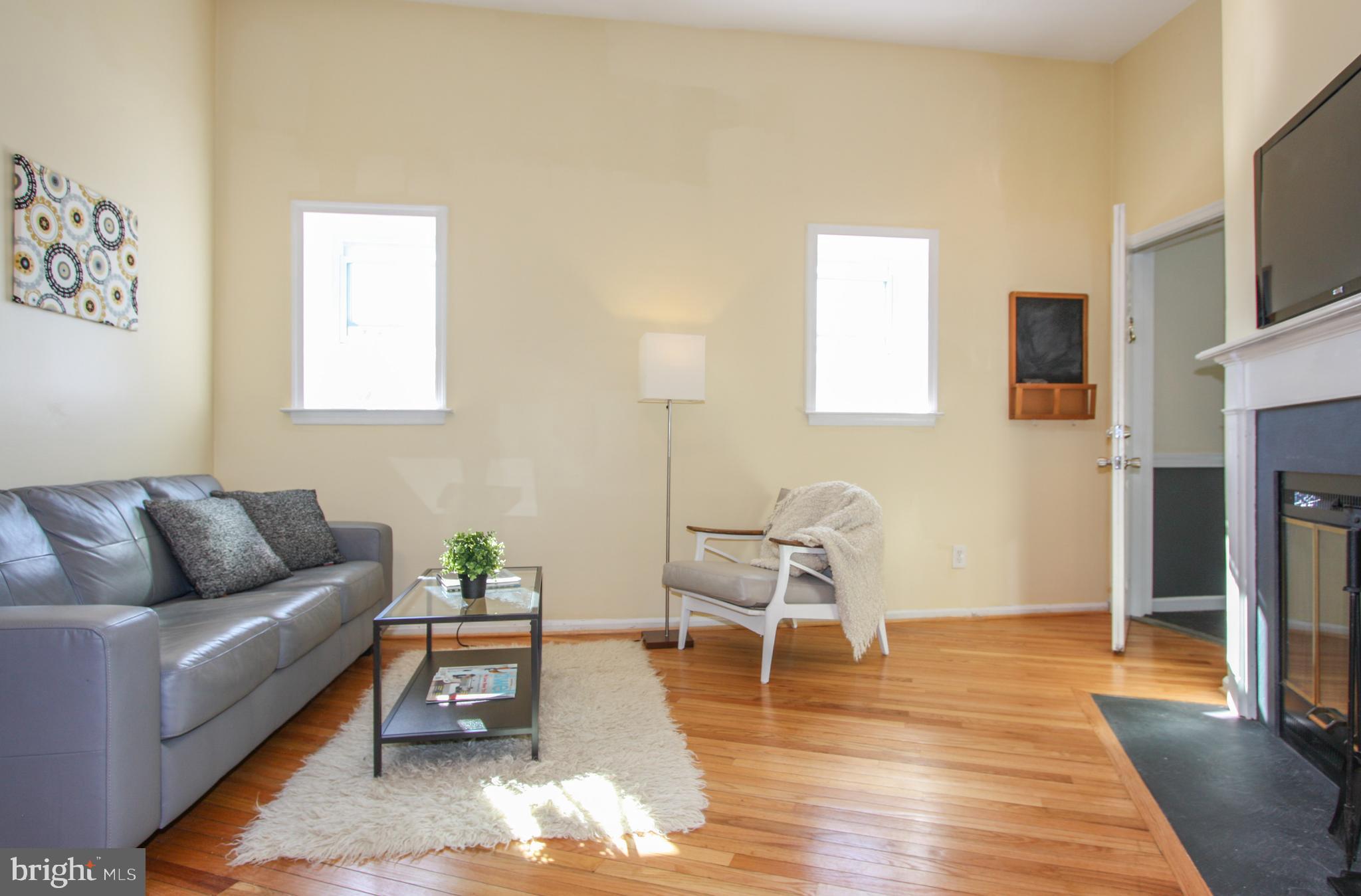 1434 Potomac Avenue Southeast, Unit 5 Washington, DC 20003 - Photo 4 of 38 a living room with furniture and a wooden floor